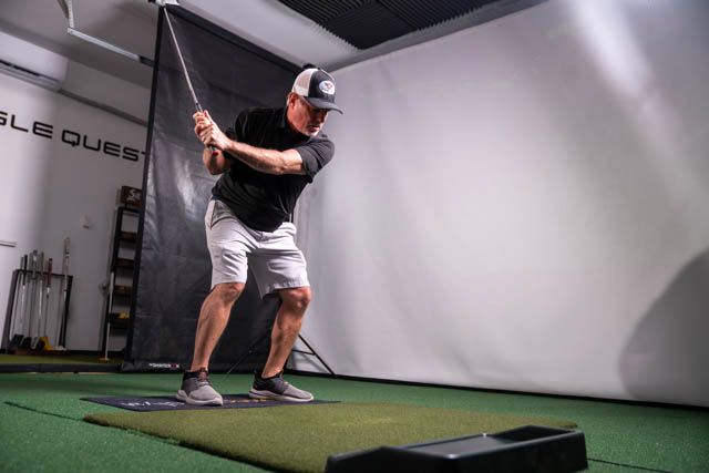 A Man In Yellow Gloves Is Cleaning A Refrigerator Door With A Cloth