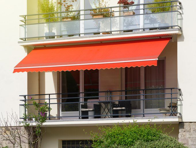 Sun protection awning at French balcony