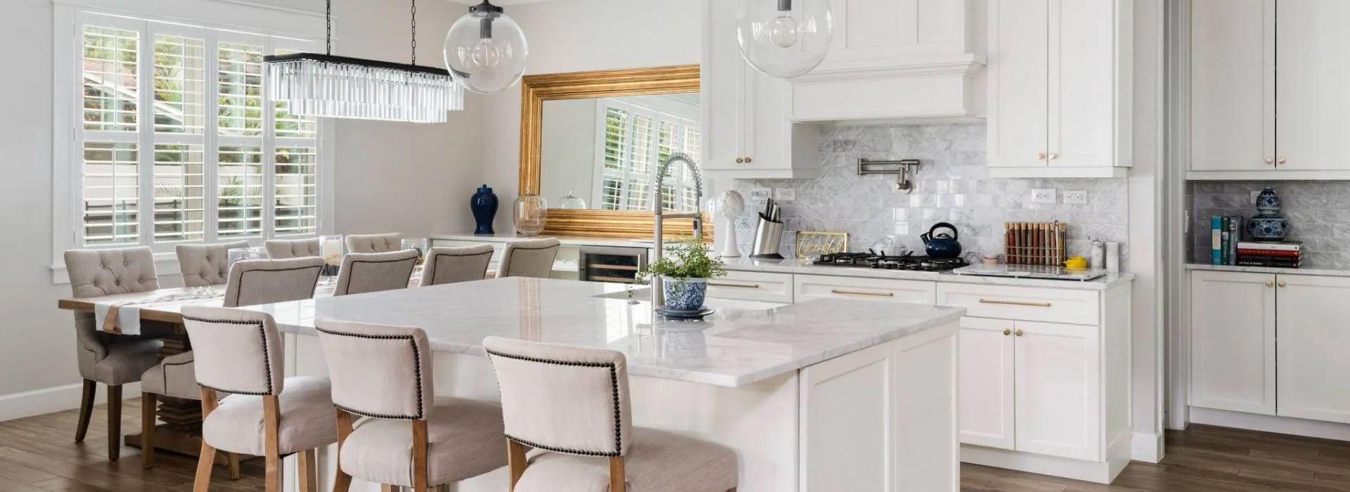 A brown granite counter top with three vases on it