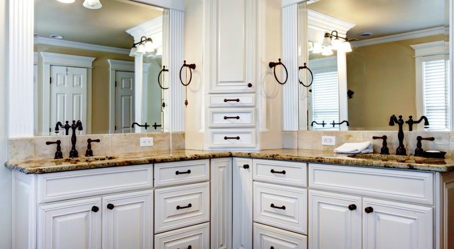 A bathroom with two sinks and two mirrors.