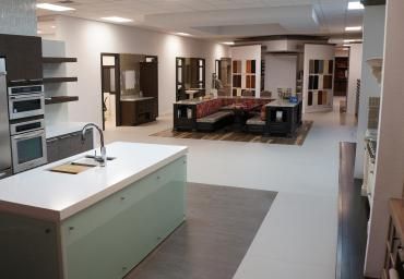 A kitchen with a large island in the middle of the room