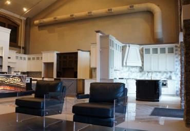 A living room with two chairs and a fireplace