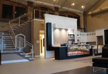 A large room with stairs and a reception desk
