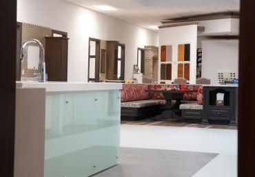 A room with a sink and a table in it