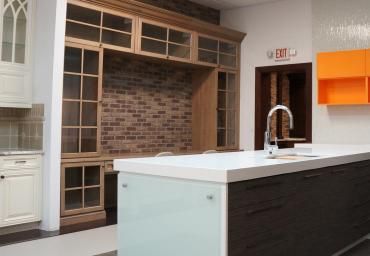 A kitchen with a large island and a sink