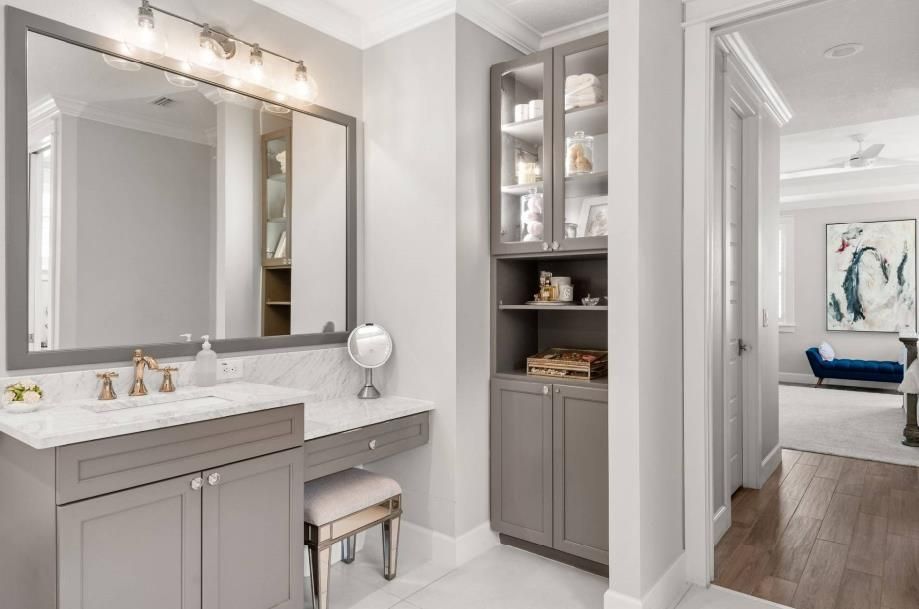 A bathroom with two sinks and two mirrors.