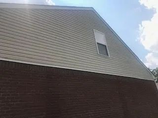 A house with a window on the side of it.