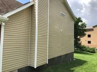 The side of a house with a lot of siding on it.