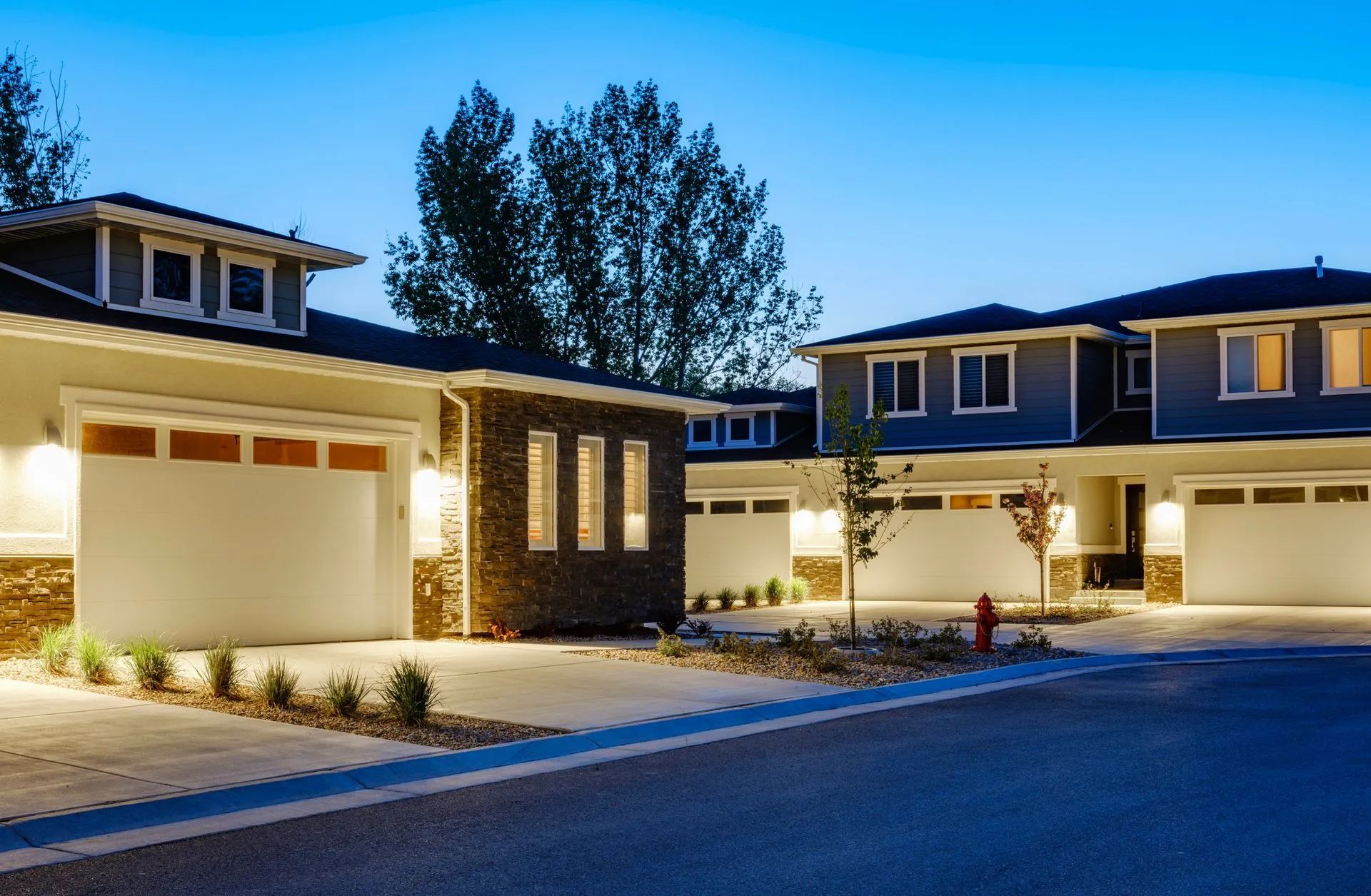 A row of houses with a fire hydrant in front of them