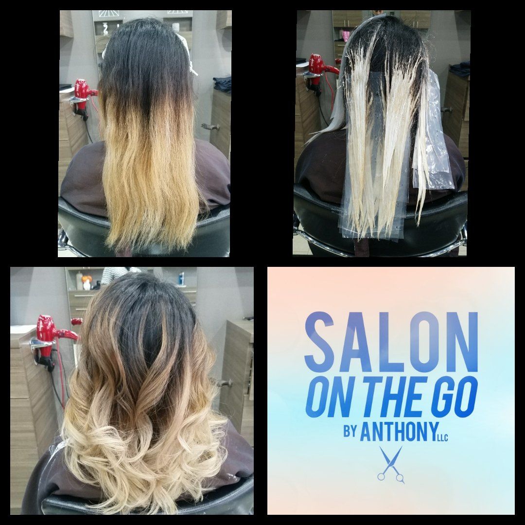 A woman is getting her hair dyed at salon on the go by anthony