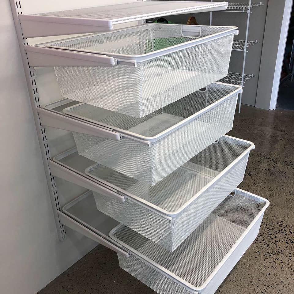 A Row of White Baskets Stacked on Top of Each Other — Cairns Custom Wardrobes in Manunda, QLD