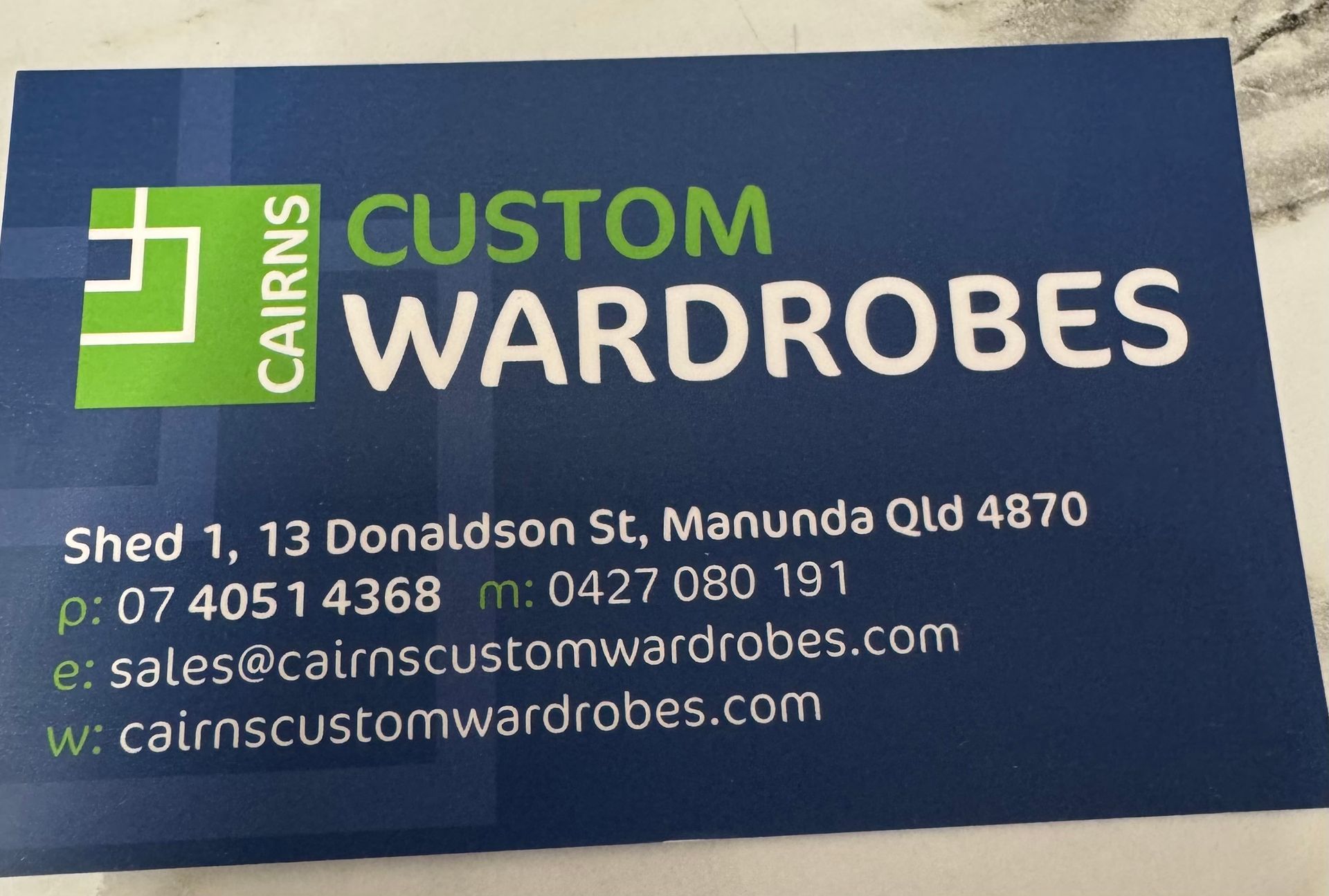 A business card with the business details  — Cairns Custom Wardrobes in Manunda, QLD