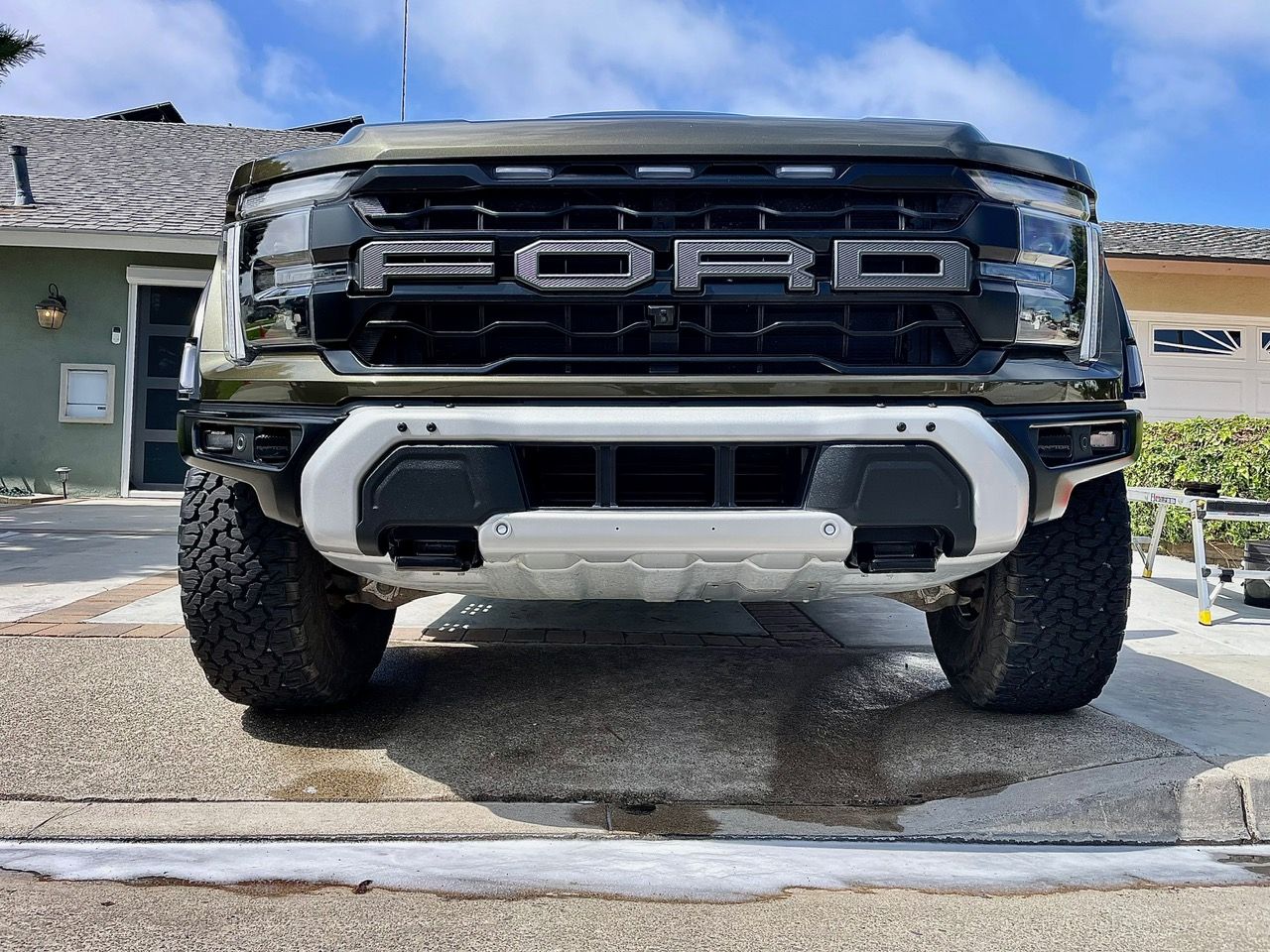 The inside of a moving truck filled with boxes and blankets.