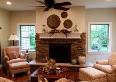 Living Room With Fireplace And A Ceiling Fan - Tyrone, PA - Fry’s Construction