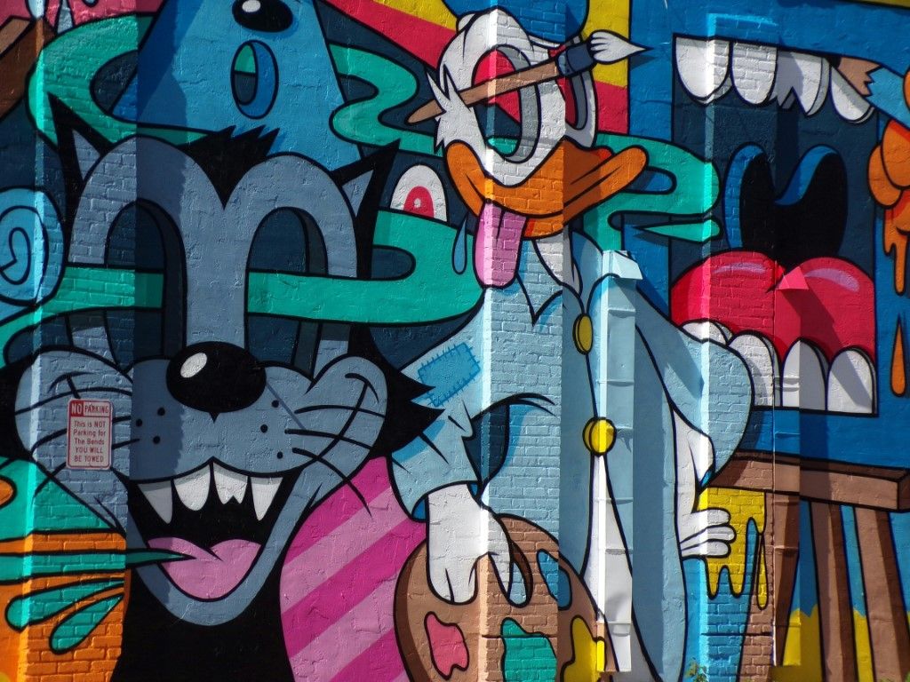 Street art masterpiece of cat and mouse on St. Pete building
