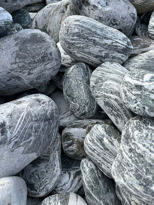 selection of zebra striped natural rocks for use in pond installation
