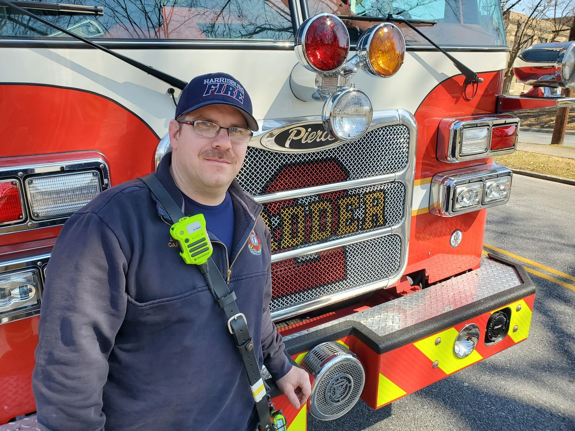 Jeremy Saul in front of a fire truck