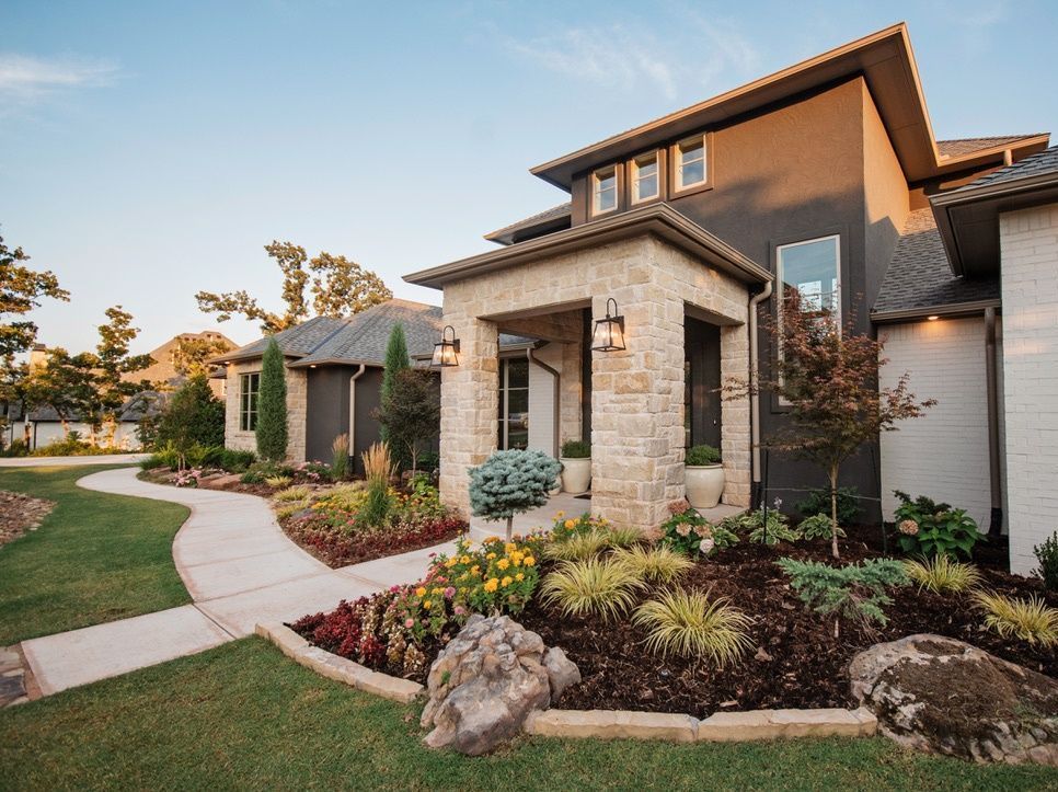 beautiful home with nicely done garden beds