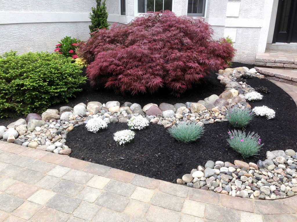 a freshly mulched planter bed