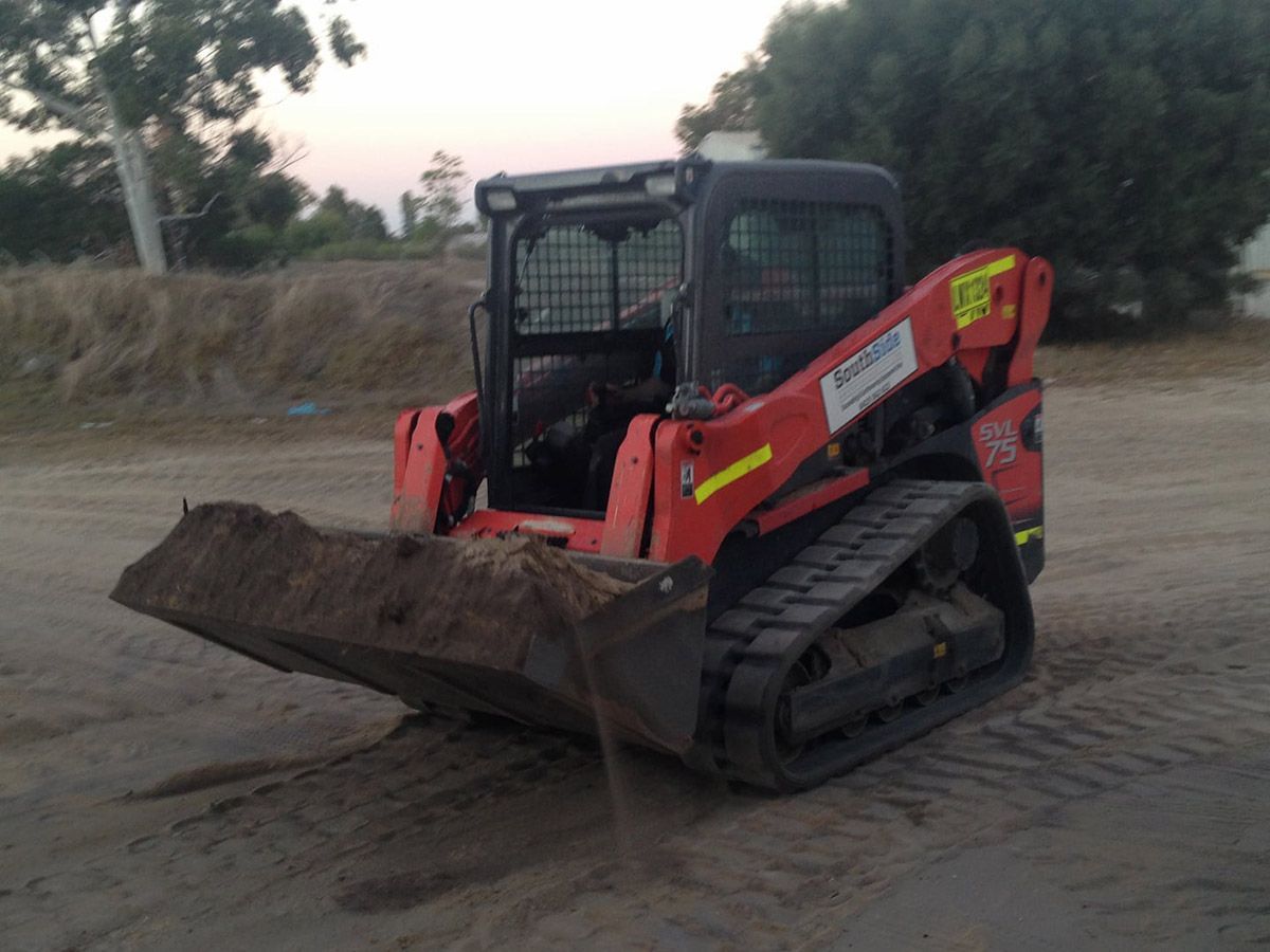 A red bulldozer with the word australian on it