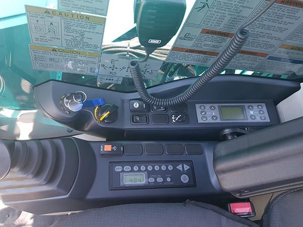 A close up of the dashboard of a vehicle with a microphone.