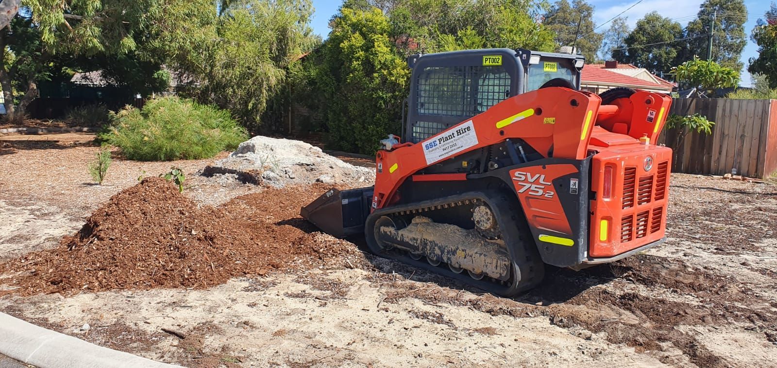 A bulldozer is digging a hole in the dirt.