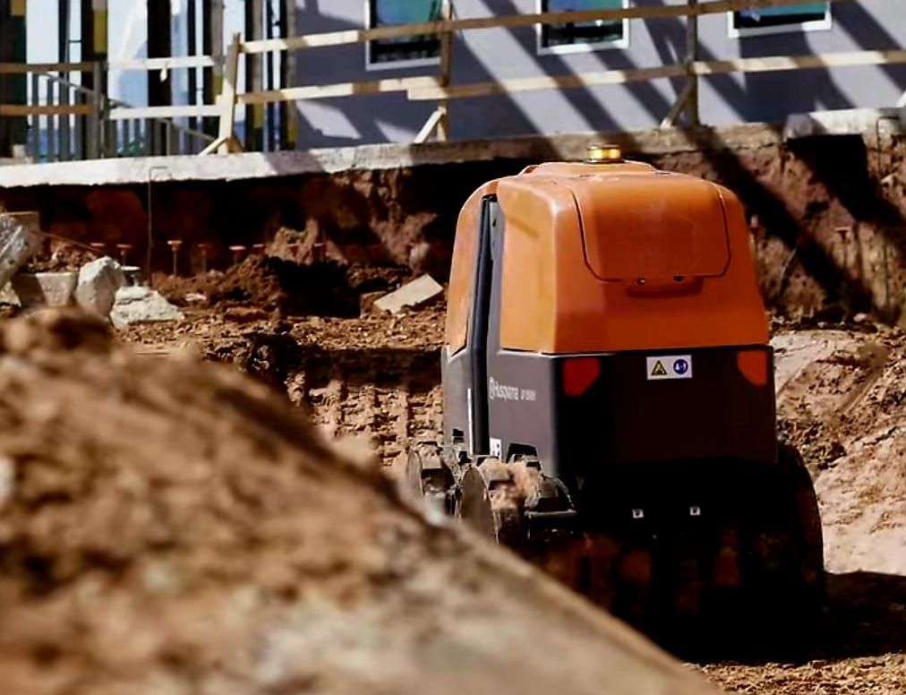 A bulldozer is moving dirt on a construction site.