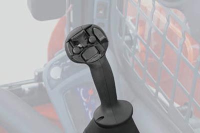 A close up of a control handle on a tractor.