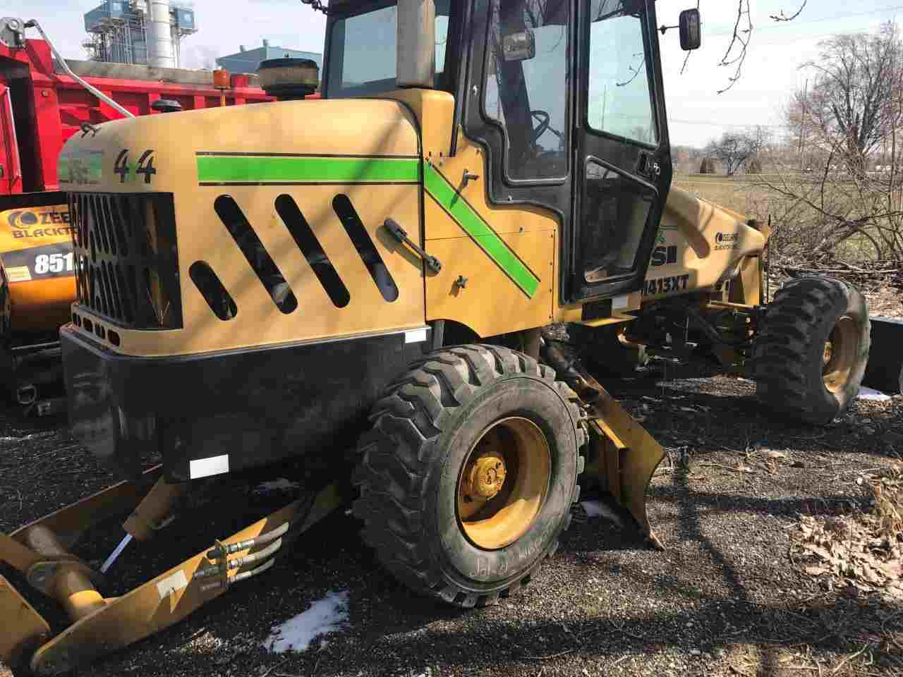 Road Construction — Front and Blackhoe Loader in Zeeland, MI