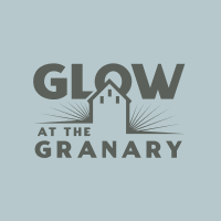 A logo for glow at the granary with a house in the middle.