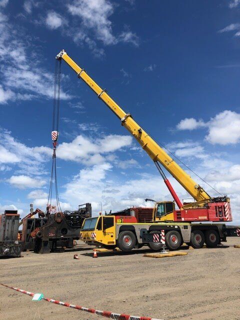 Crane Lifting A Machine — Crane Hire & Transport in Moranbah, QLD