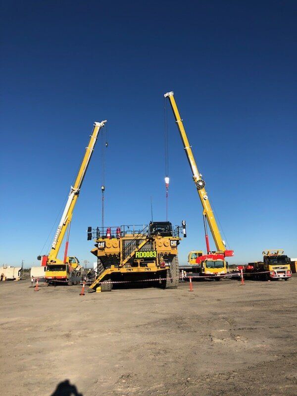 Two Mobile Cranes Lifting An Equipment — Crane Hire & Transport in Moranbah, QLD