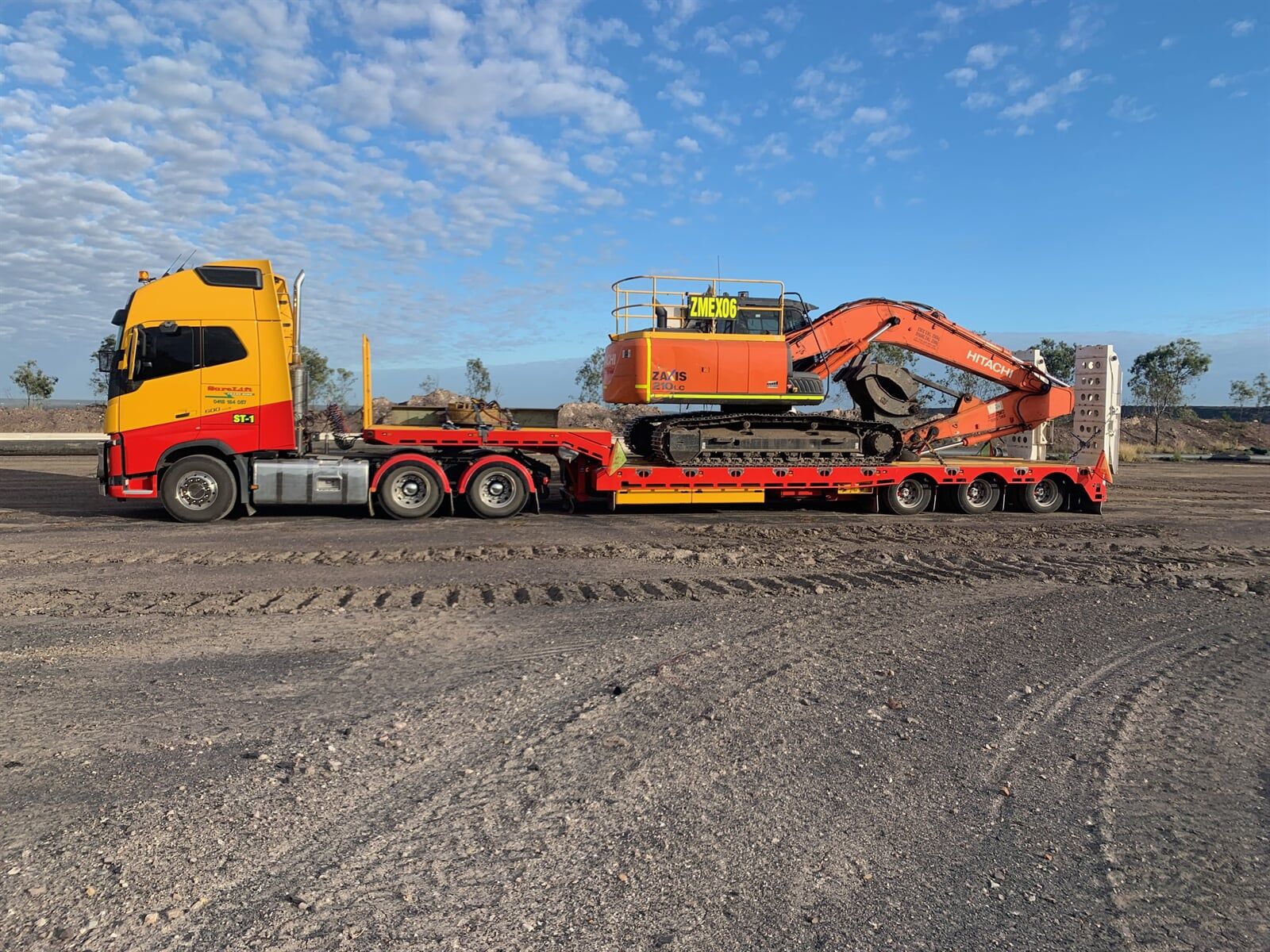 Crane Truck Loaded With Heavy Equipment — Crane Hire & Transport in Moranbah, QLD