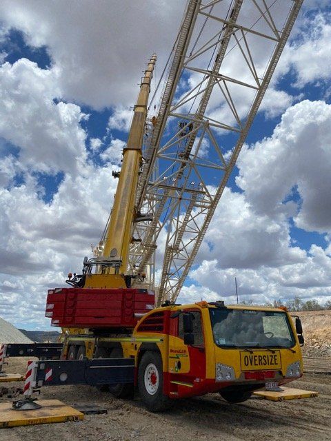 Yellow And Red Crane Truck — Crane Hire & Transport in Moranbah, QLD