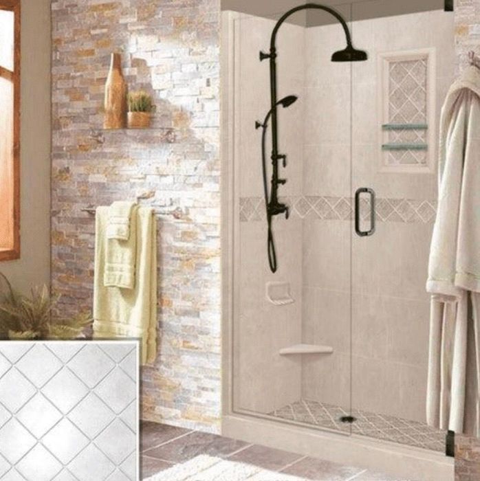 Bathroom with glass shower, stone wall, and dark fixtures; towel rack with towels, bathrobes.