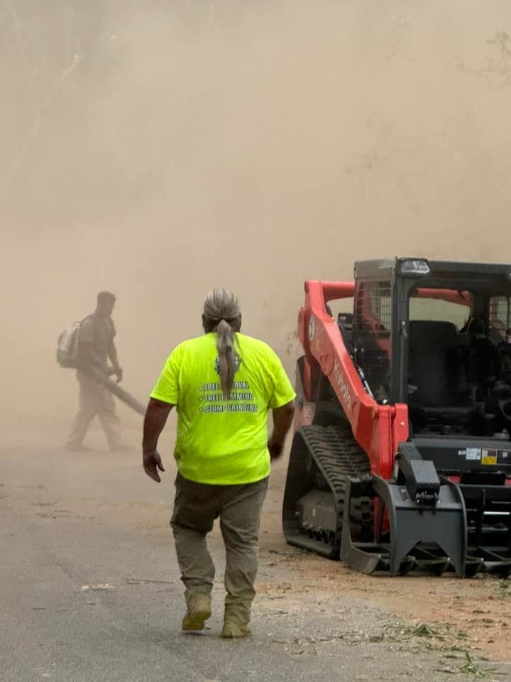 A man wearing a yellow shirt that says ' construction ' on it