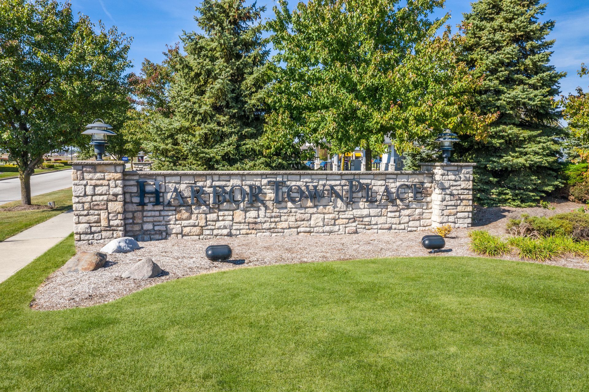 Stone entrance sign for Harbor Town Estates.