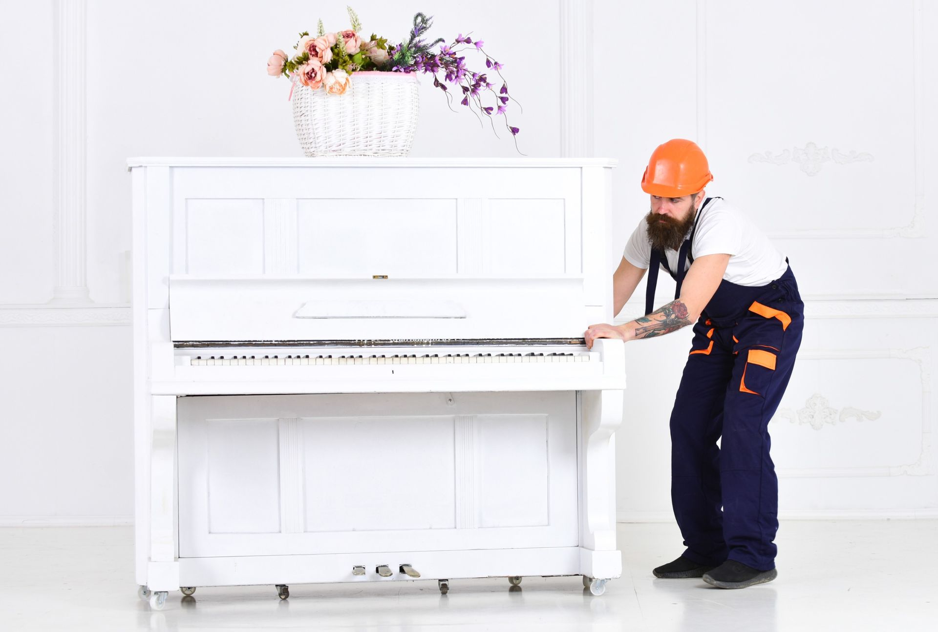 A professional mover moving a piano