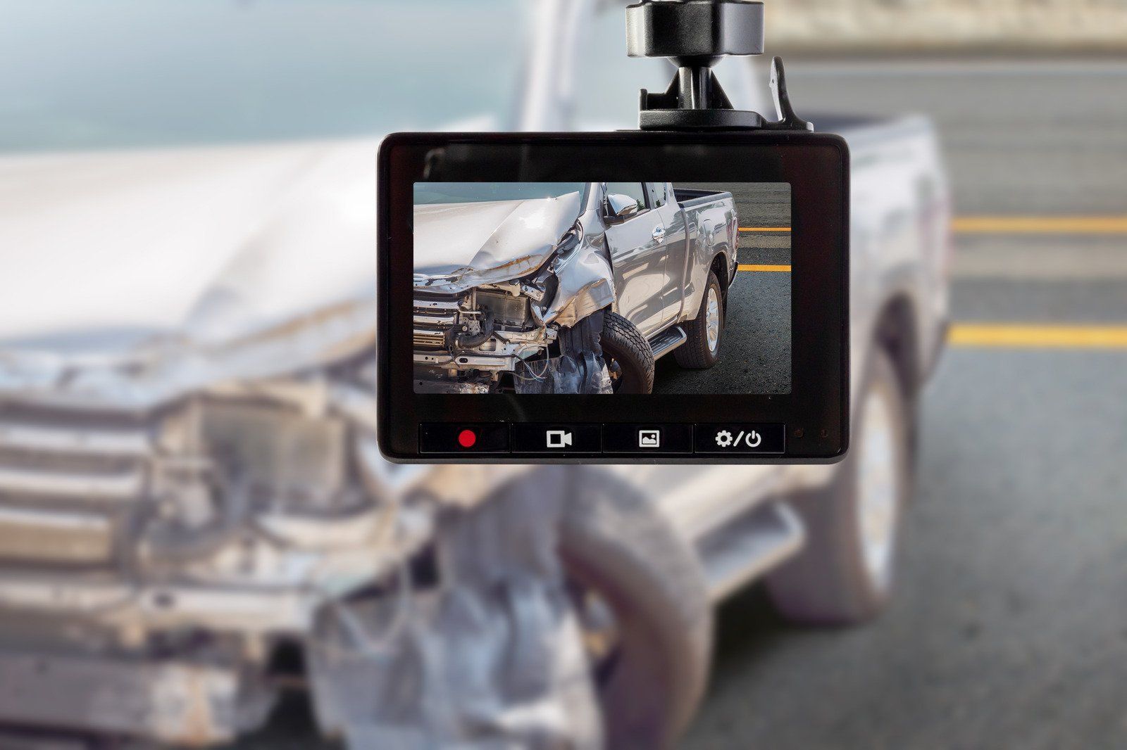 Dashcam screen displaying a damaged truck, likely after a collision