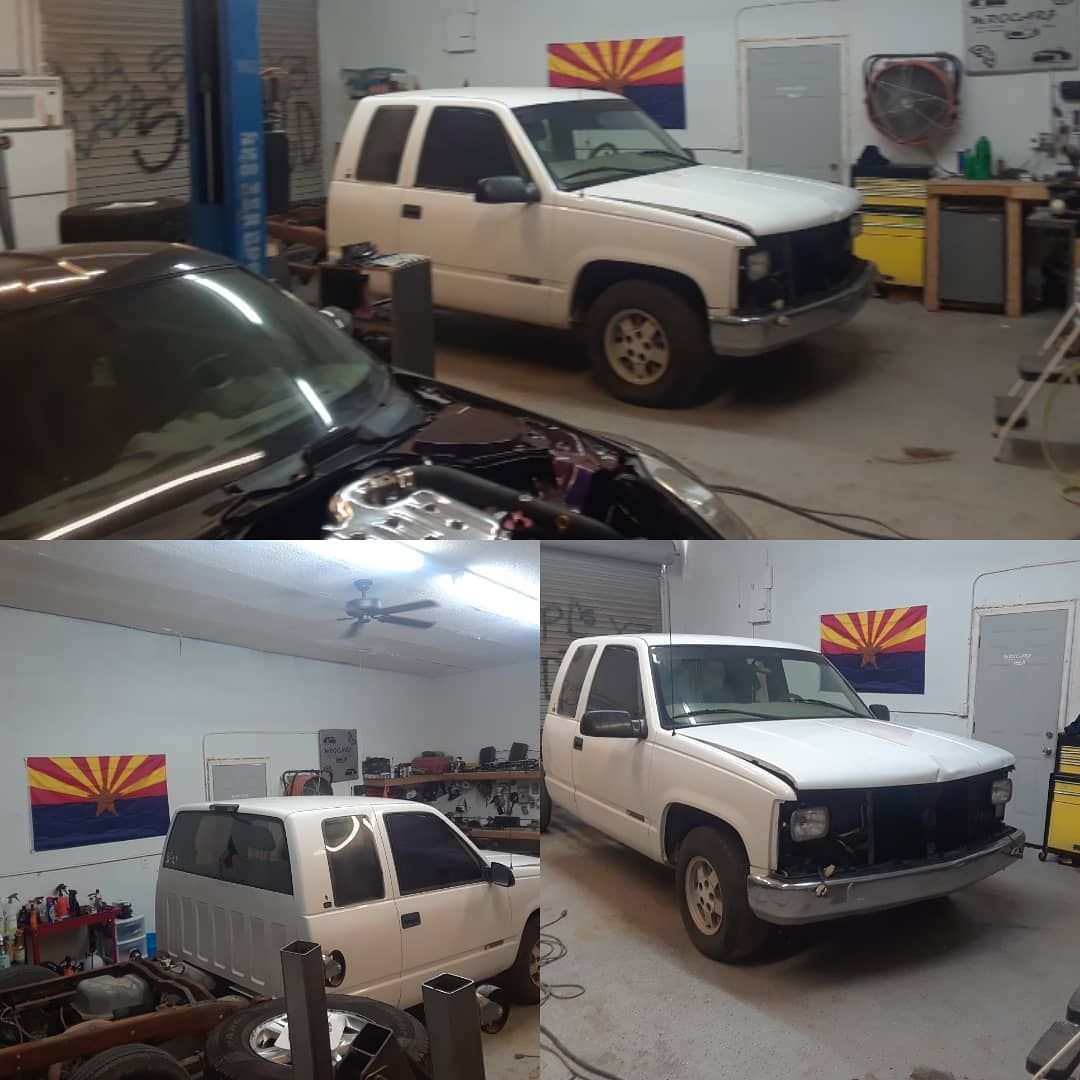 Four views of a white Chevrolet SUV inside a garage, partially disassembled. An Arizona flag hangs on the wall.