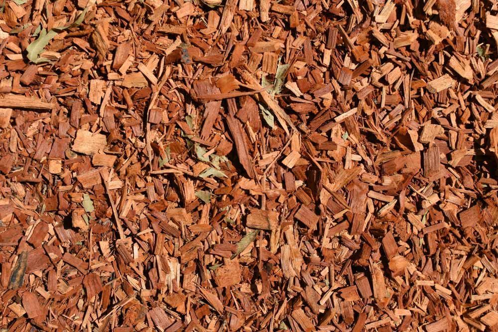 A Pile of Brown Wood Chips is Laying on the Ground — Dampier Street Landscape Supplies in Taminda, NSW