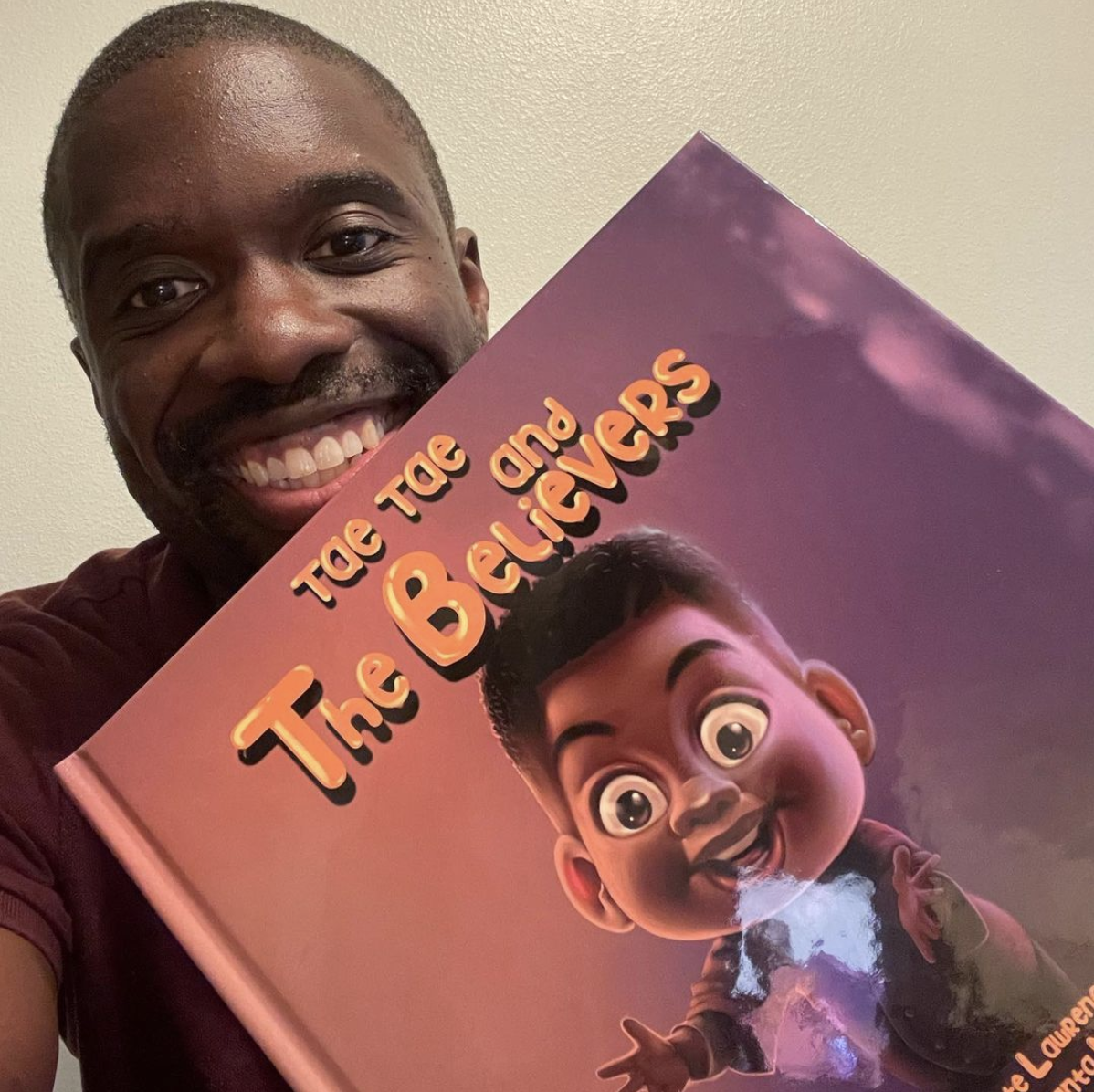 Author Diante Lawrence Holding Book - Tae Tae and the Believers