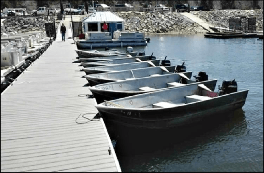 7 fishing boats tied to a dock in Big Bear Lake