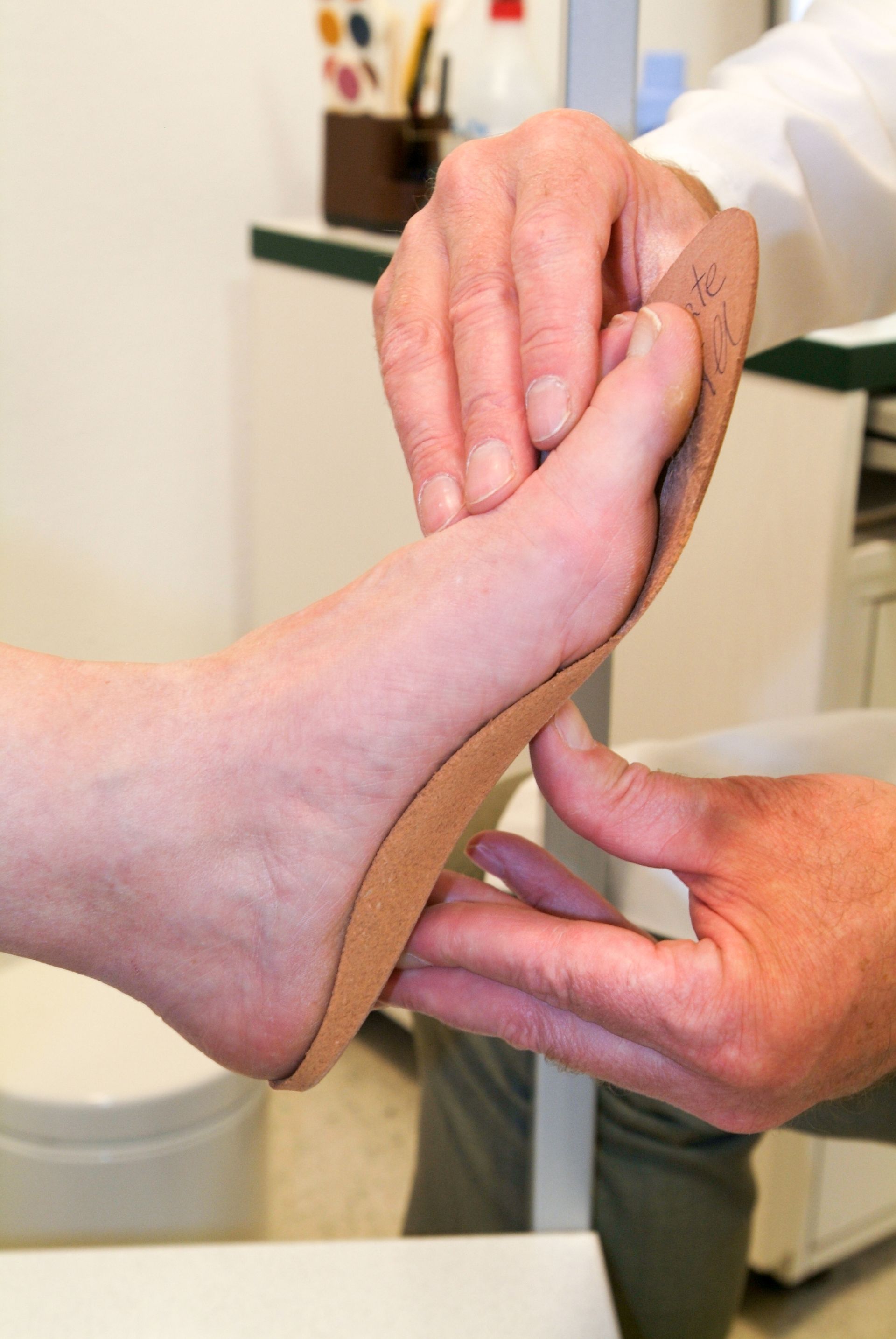 A person 's foot is being examined by a doctor