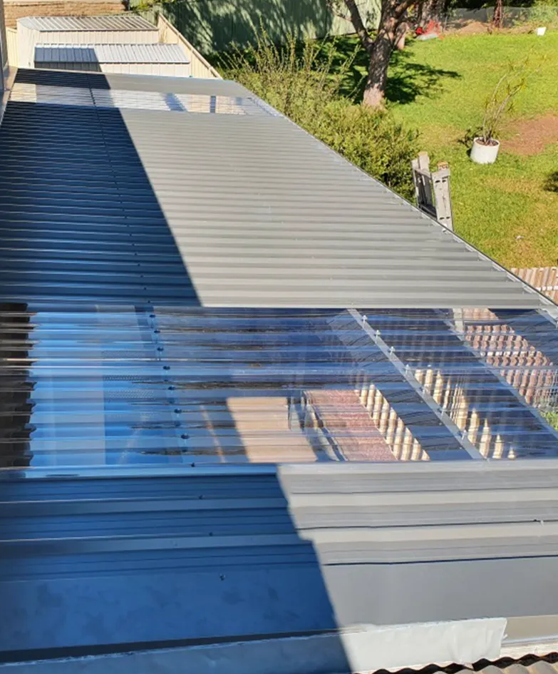 Metal roofing with transparent sections