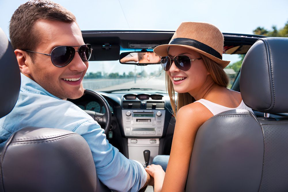 A Man And A Woman Are Happy In A Car — 100% Automotive In South Nowra, NSW