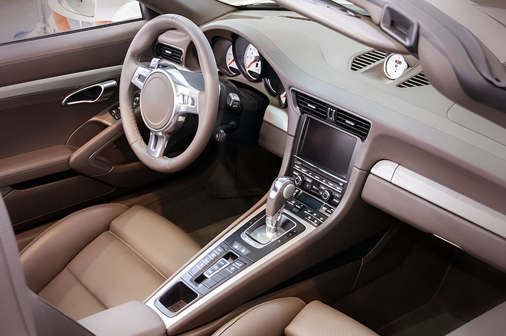 The Interior Of A Car With A Steering Wheel And Dashboard β 100% Automotive In South Nowra, NSW