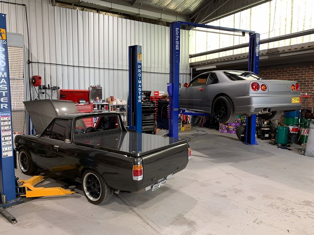 A Car Is Sitting On A Lift Following The Logbook Servicing β 100% Automotive In South Nowra, NSW