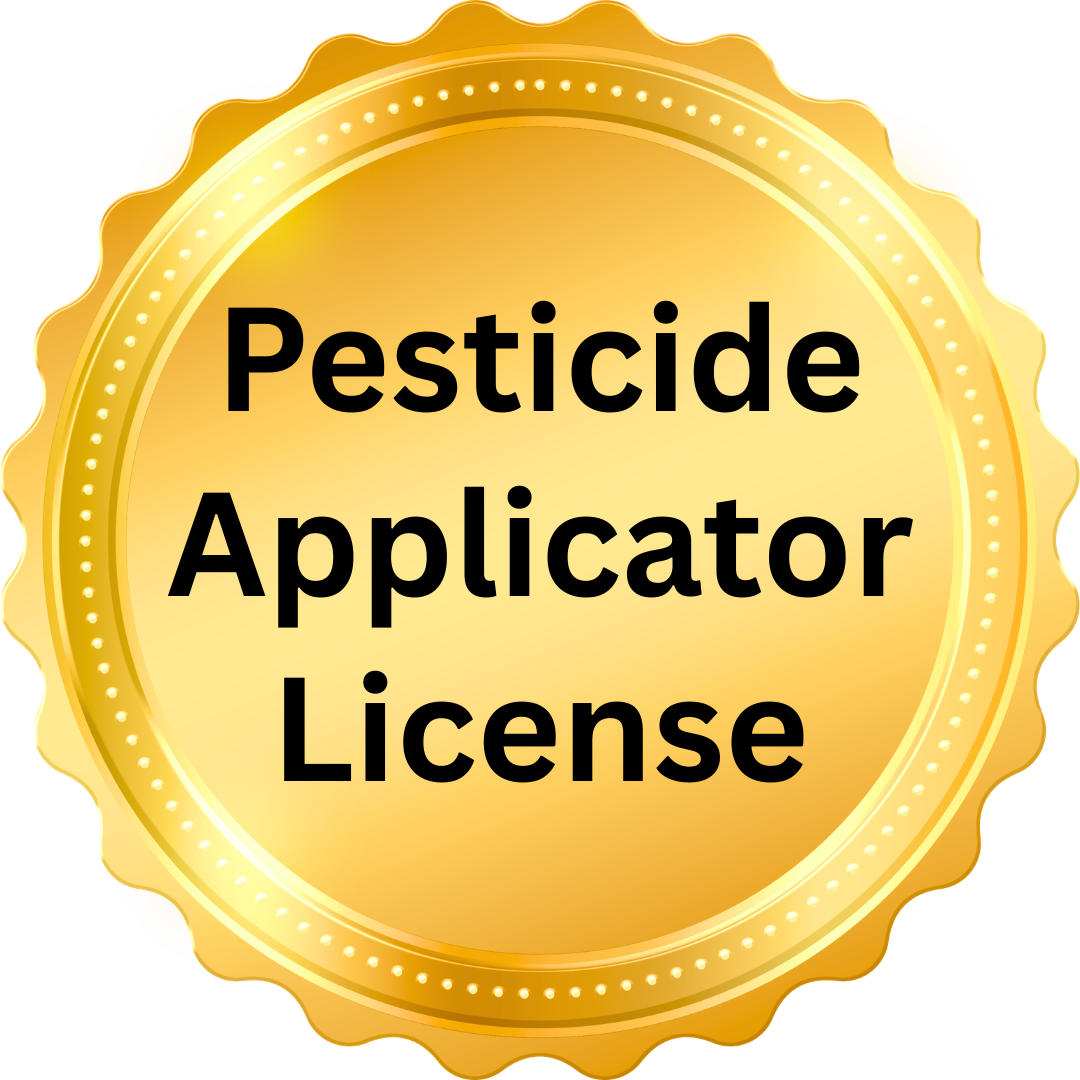 A gold-colored, circular seal with a scalloped edge and the text