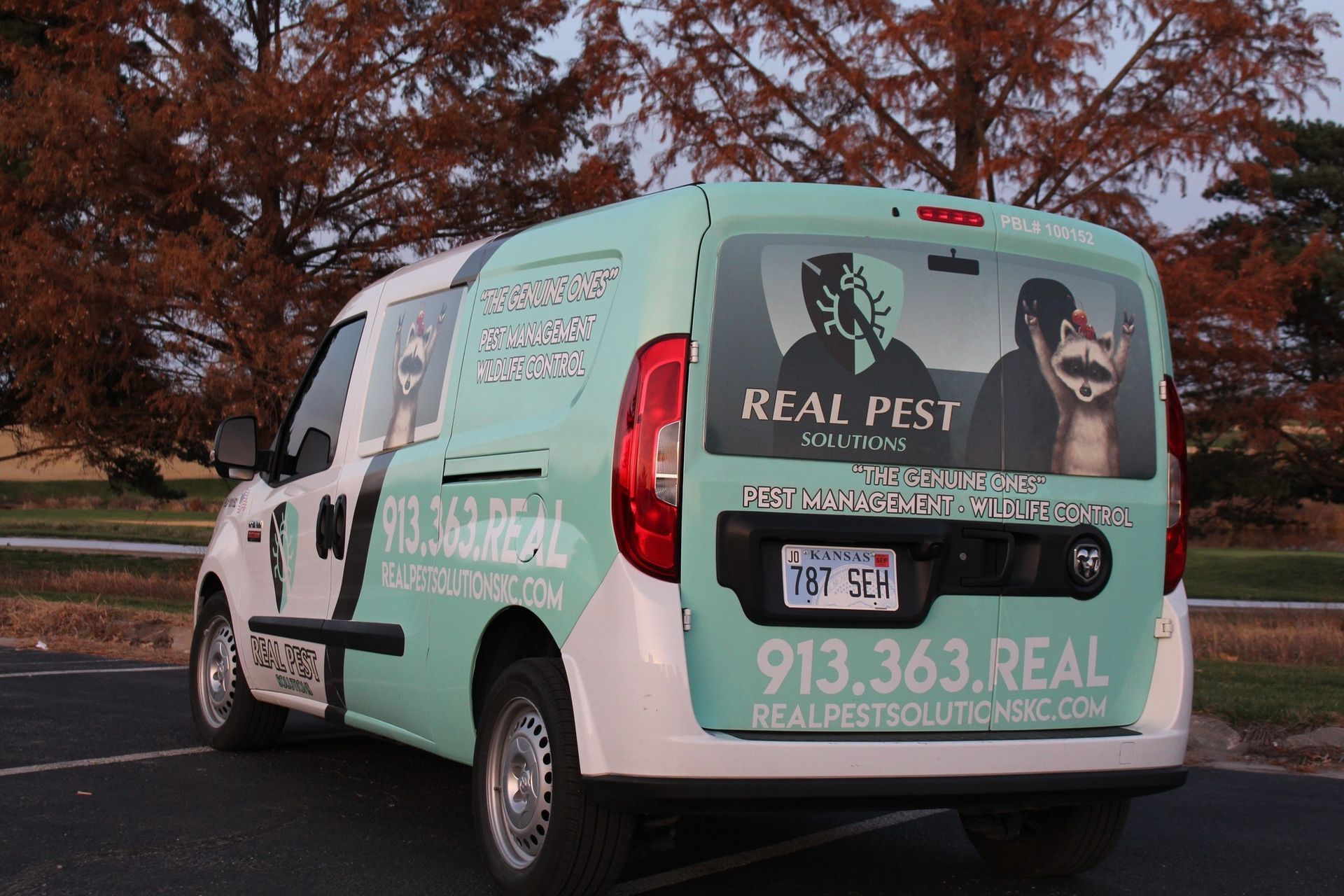 A light teal service van with 